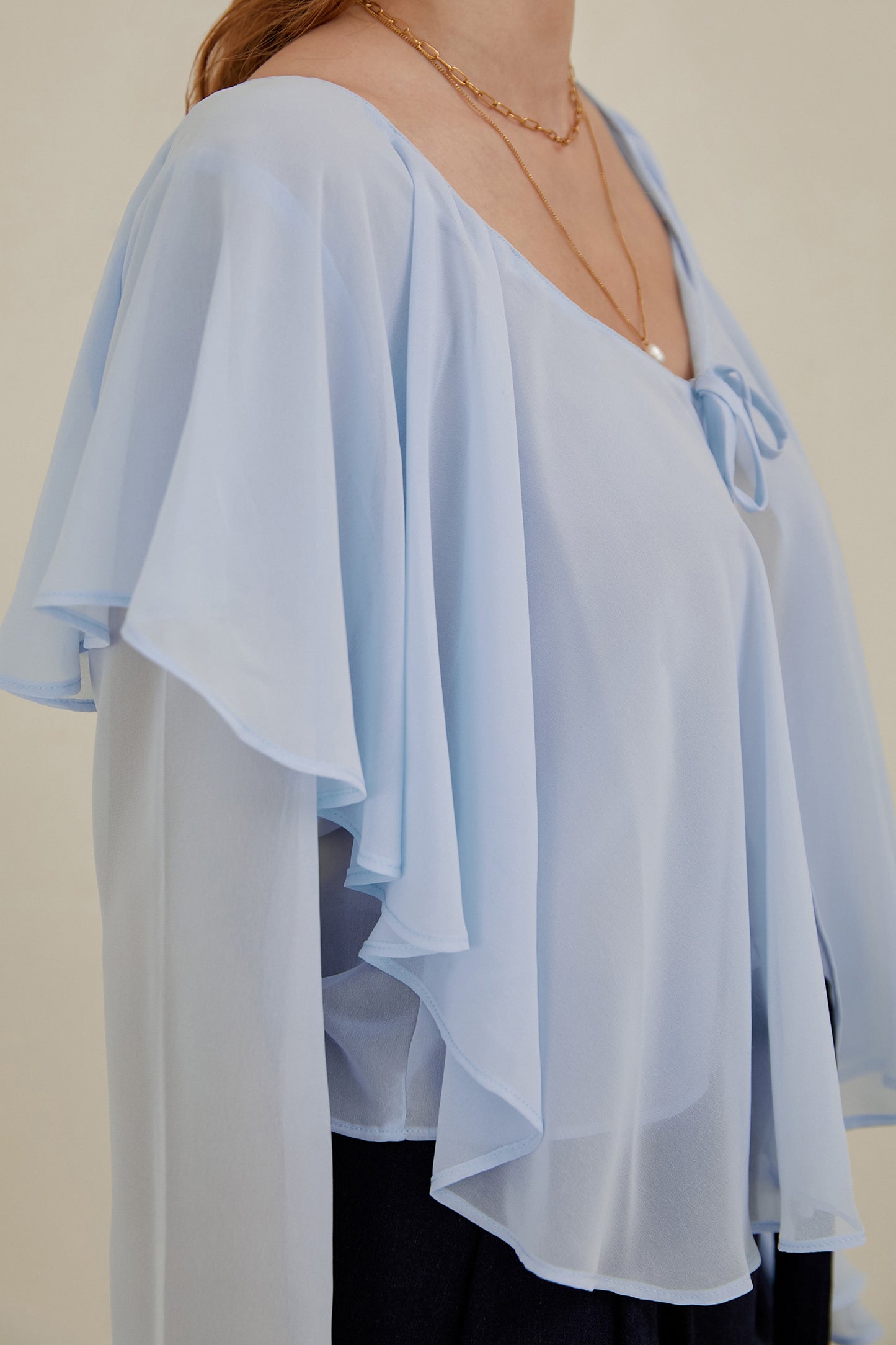 Blusa con volantes - Celeste