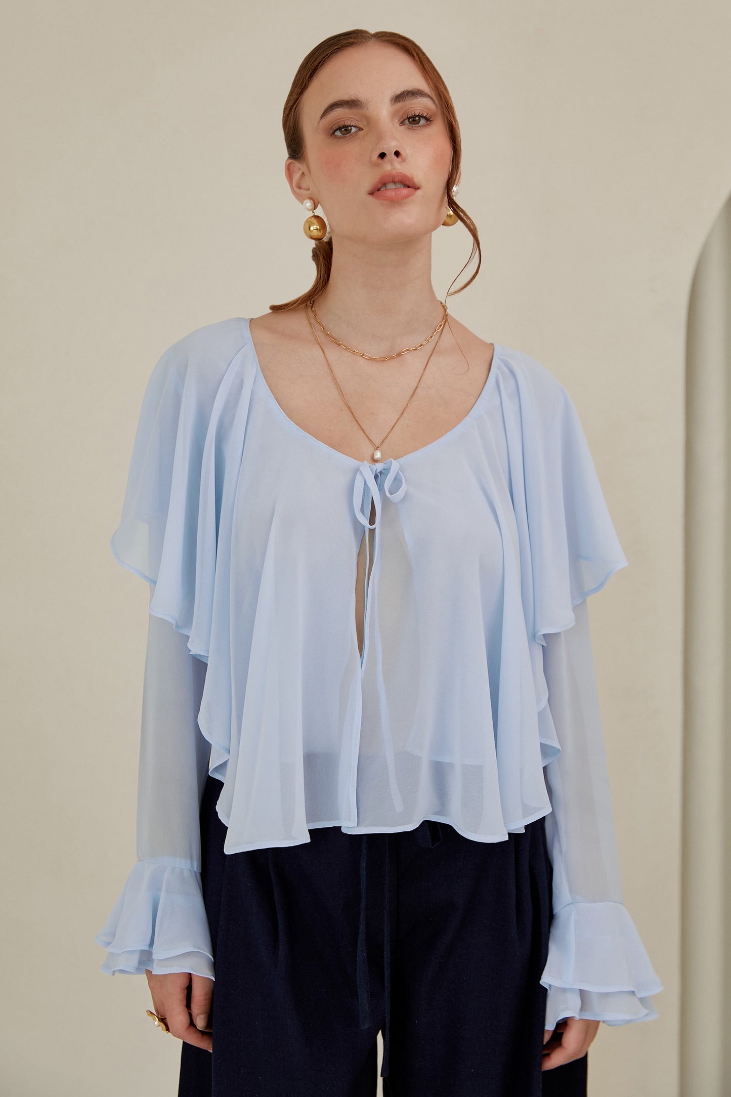 Blusa con volantes - Celeste