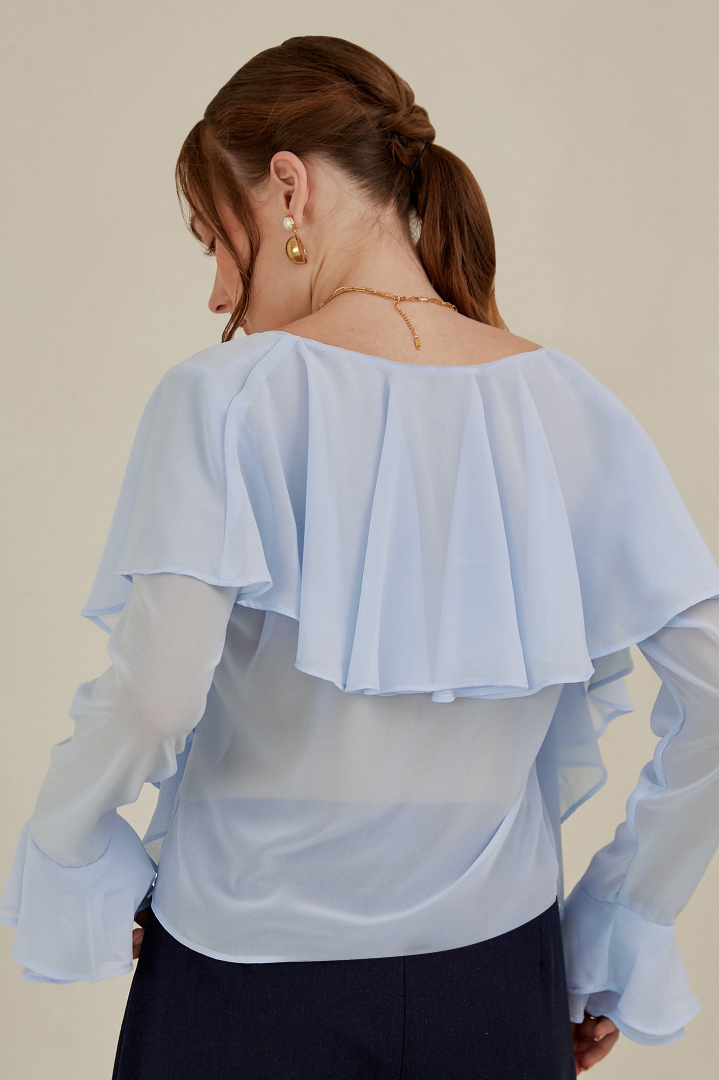 Blusa con volantes - Celeste